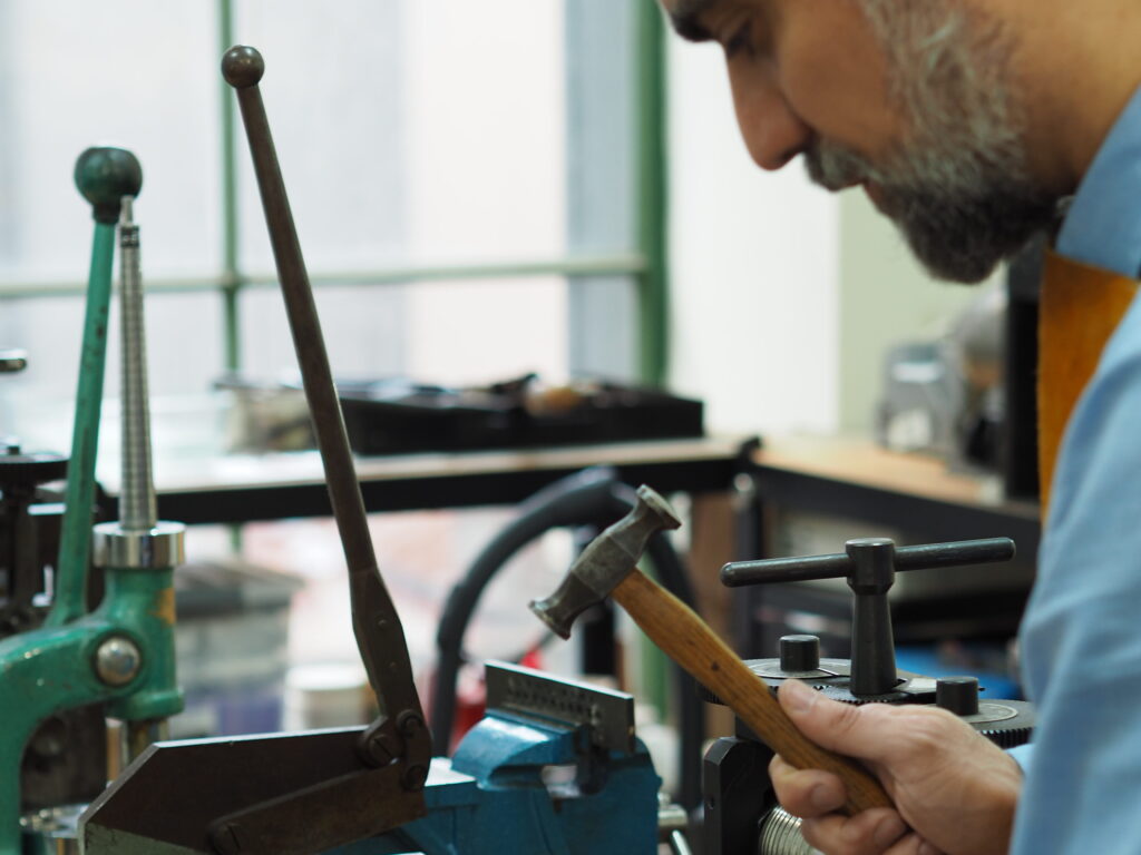 Hand beating gold for a custom bespoke ring